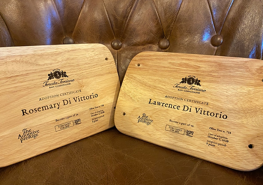 Two personalised wooden adoption plaques